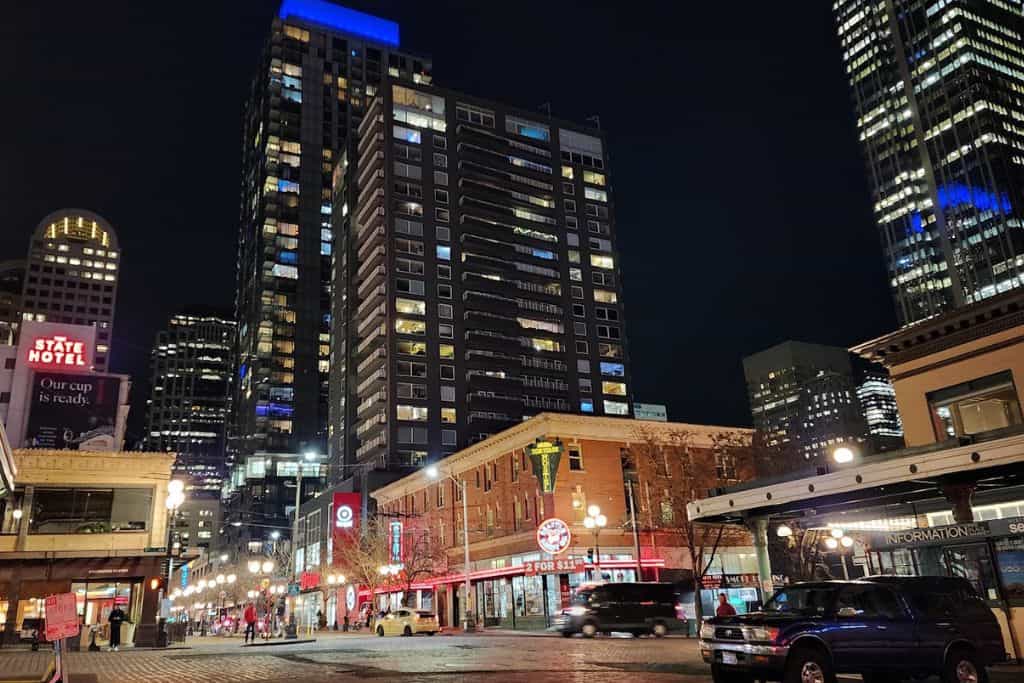 Skyscrapers and downtown city at night with a lot of cars