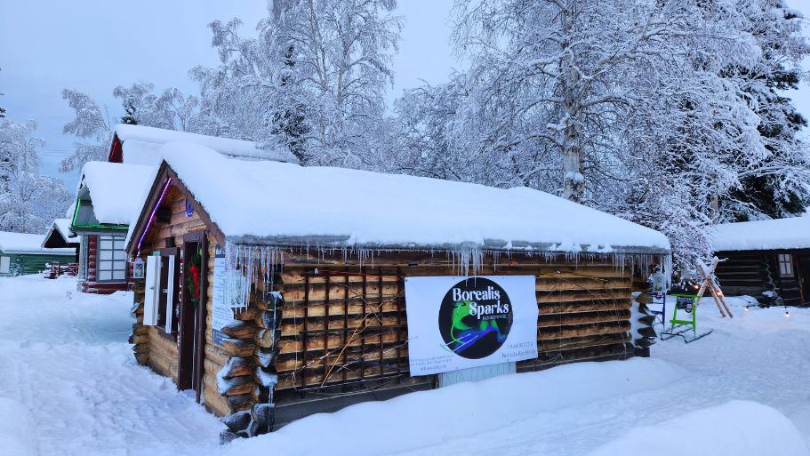 snow-covered log cabins