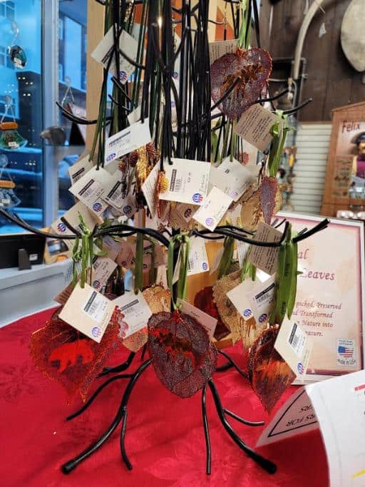 Ornaments hanging on a metal rack in a store window