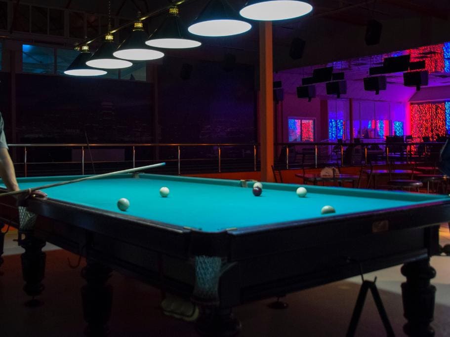 Pool table in a colorful bar