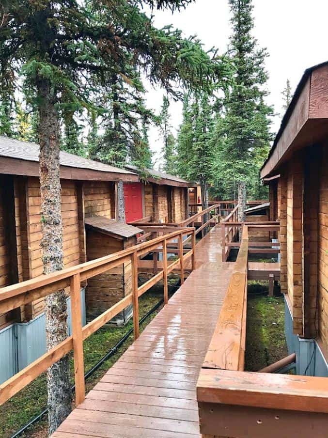 Wooden walkway leading to several cabins