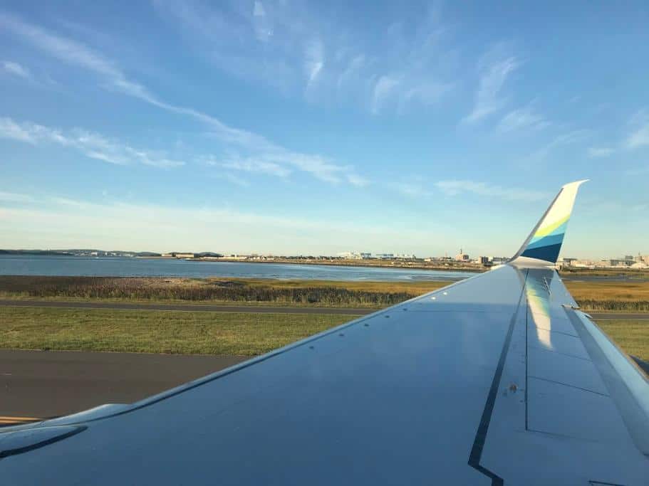 Alaska Airlines airplane wing over Boston harbor