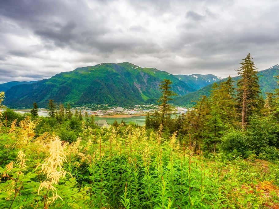 Vibrant photo of a cloudy day over mountains and a distant coastal town