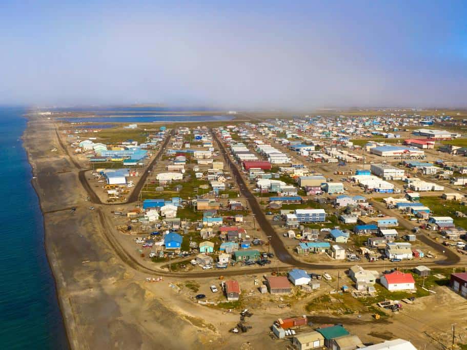 Aerial view of small town on the edge of the ocean fitted with all small buildings