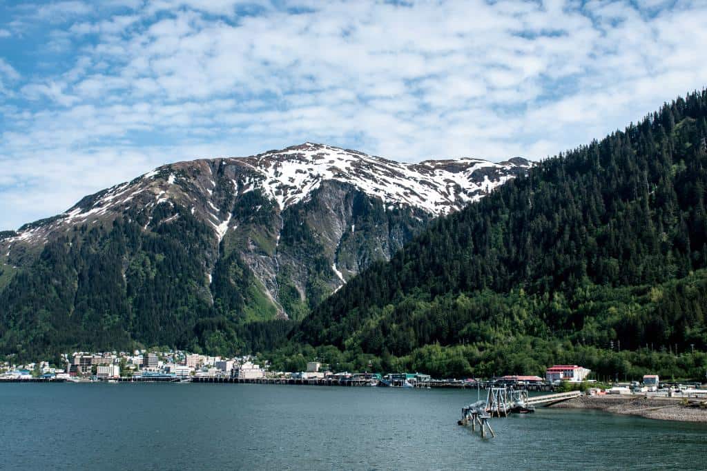 City of Juneau backed by snowy mountains and trees