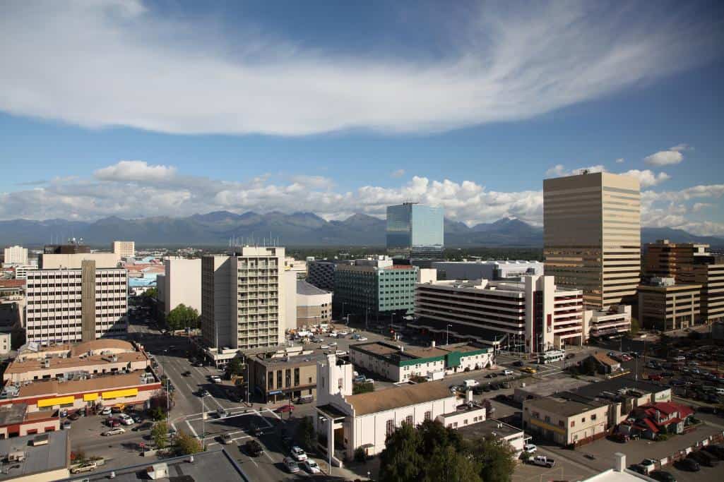 A city with a blue sky and clouds