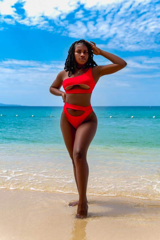 Girl in an orange bikini on a tropical beach
