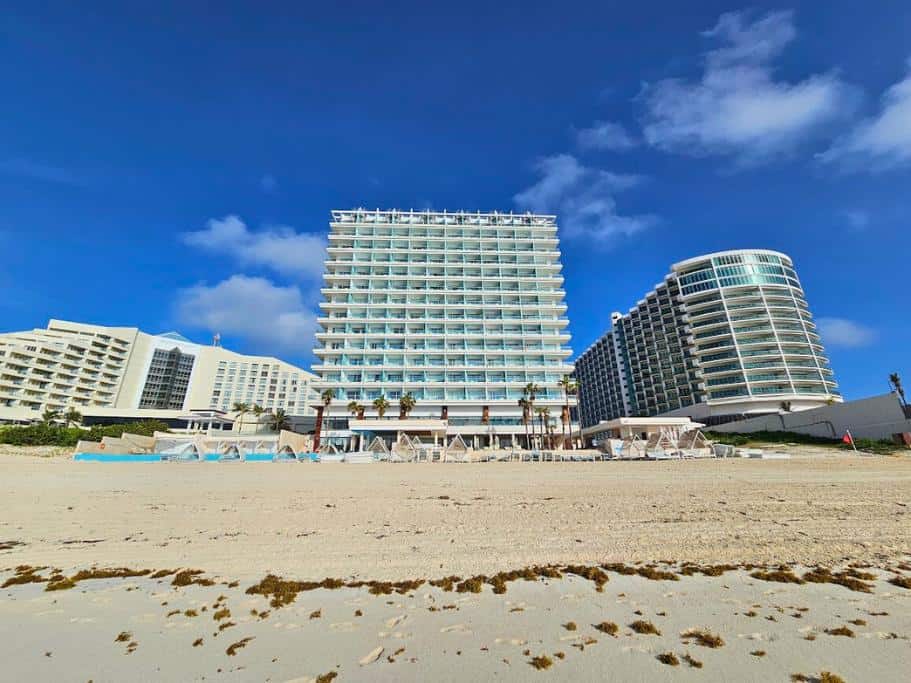 Front view of beachfront resort on a sunny day