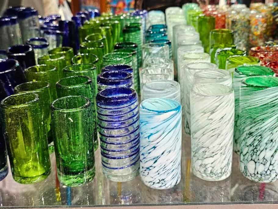 Shelf of colorful and tall shot glasses