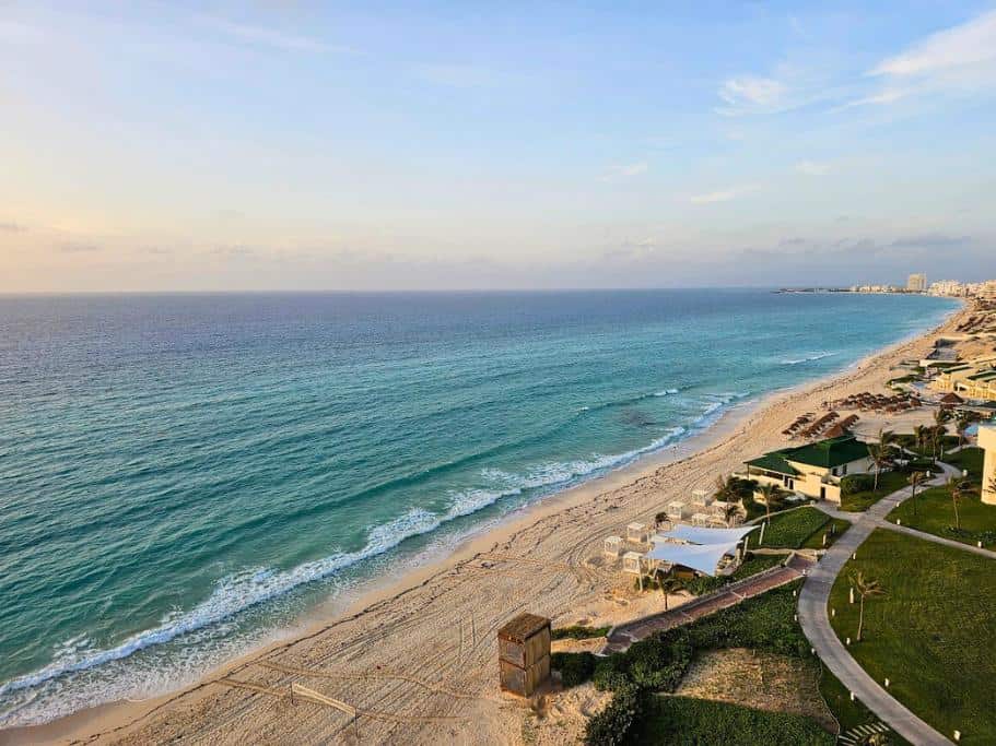 Sunrise photo of a beautiful beach with some cabanas along Cancun's hotel zone