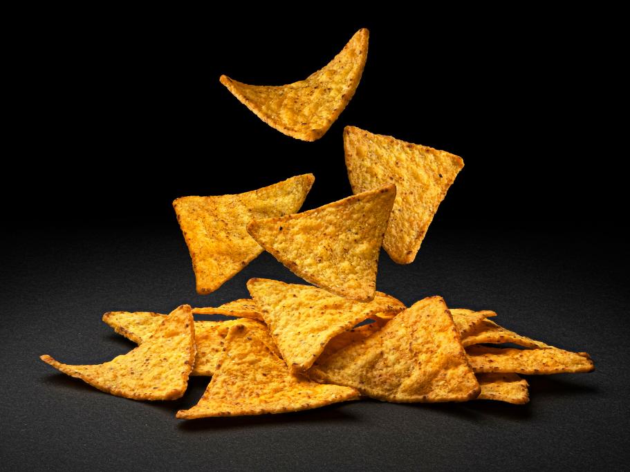 Orange chips falling into a pile
