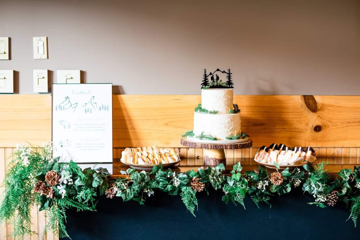 Cake table with greenery