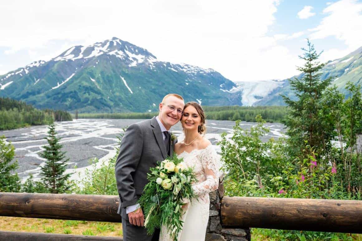 Sean and Emily Concannon getting wedding photos taken in front of Exit Glacier in Alaska