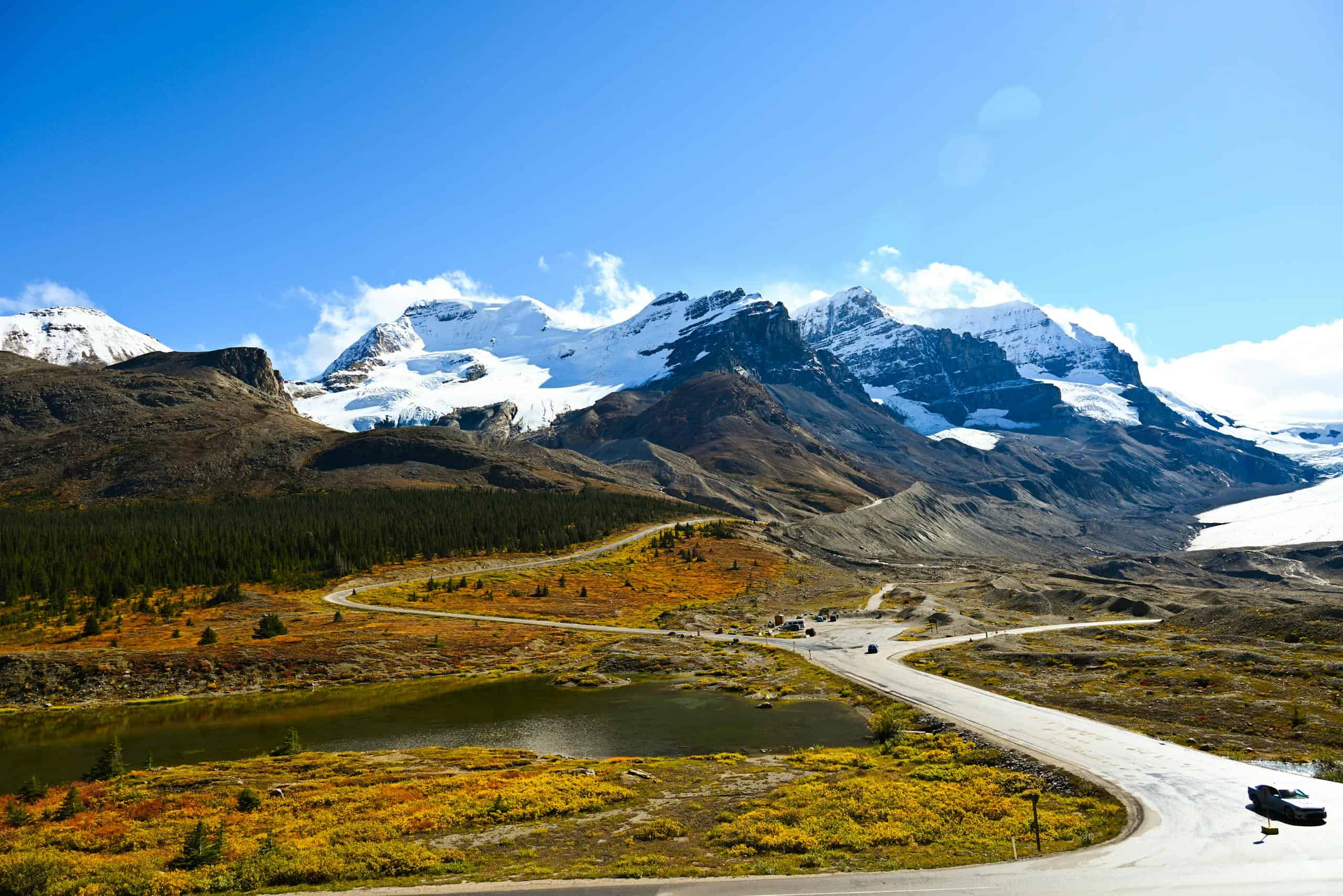 Capture the stunning beauty of Mount Athabasca with a winding road in Jasper National Park.