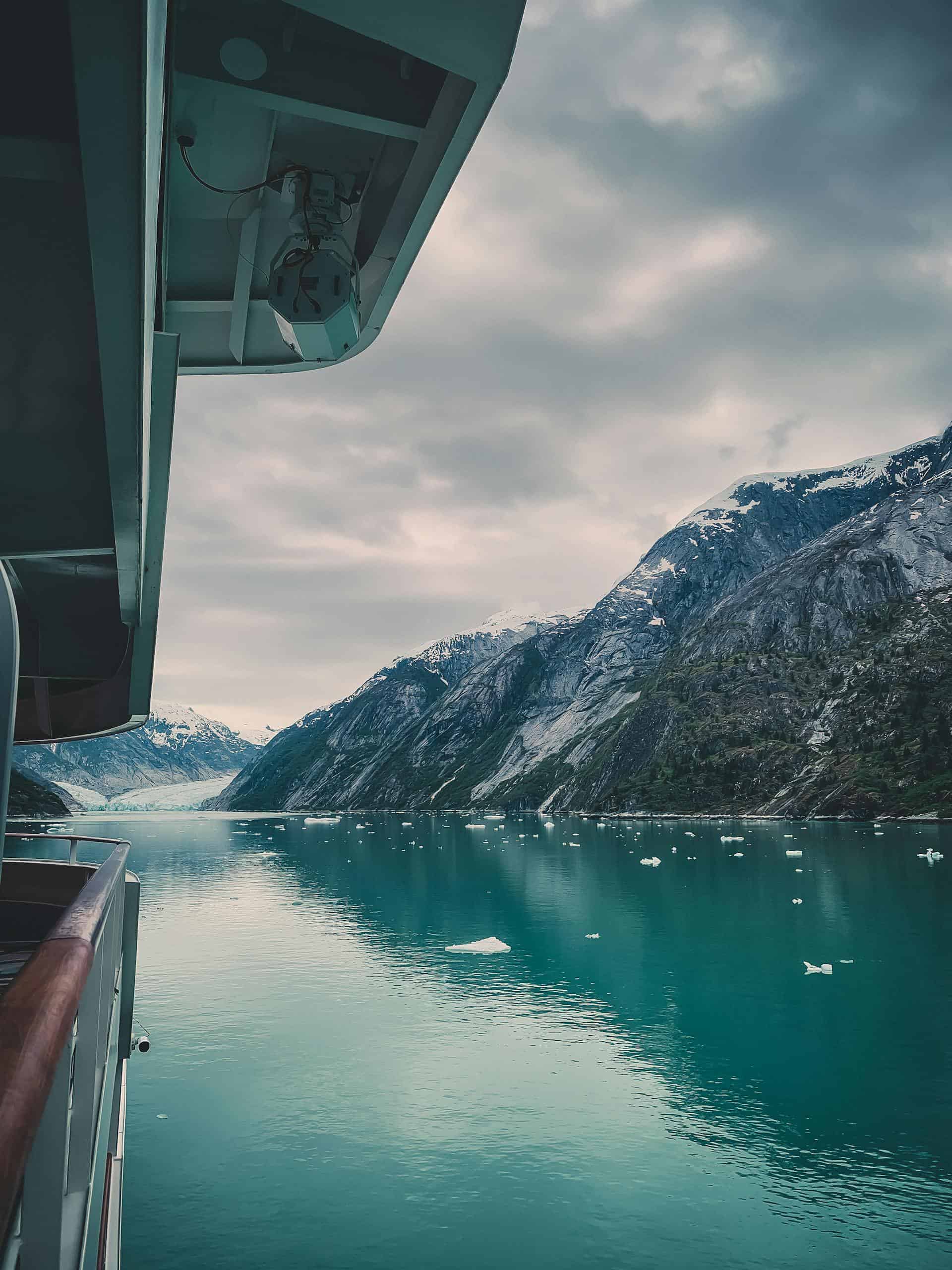 Experience the breathtaking Alaskan glaciers from a cruise ship in tranquil icy waters.