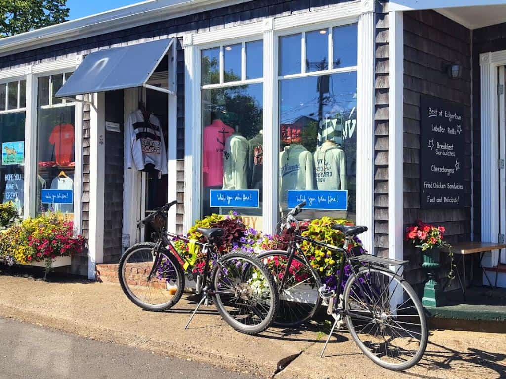 Two bikes in front of a quaint shop with flower boxes on Martha's Vineyard